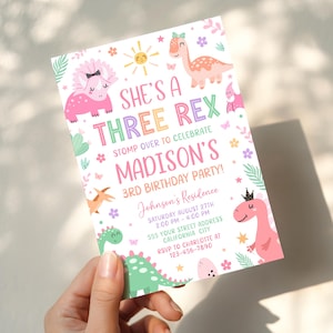 May include: A white birthday party invitation card featuring colorful illustrations of dinosaurs, flowers, and a sun. The text reads: SHE'S A THREE REX STOMP OVER TO CELEBRATE MADISON'S 3RD BIRTHDAY PARTY! Johnson's Residence, Saturday August 27th, 2:00 PM - 4:00 PM, 555 Your Street Address, California City, RSVP to Charlotte at 123-456-7890.