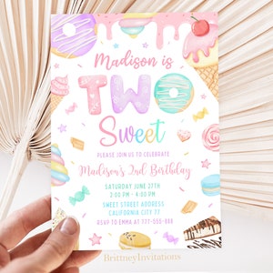 May include: A colorful invitation for a child's second birthday party. The invitation features a sweet theme with a donut, ice cream, and candy. The text on the invitation reads "Madison is Two Sweet" and includes the date, time, and location of the party. RSVP information is also included.