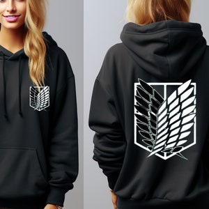 May include: Black hooded sweatshirt with a white graphic of the Attack on Titan symbol on the front and back.