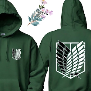 May include: A dark green hoodie with a white and black graphic of the Wings of Freedom symbol from the anime Attack on Titan. The symbol is on the back of the hoodie and a smaller version is on the front left chest.
