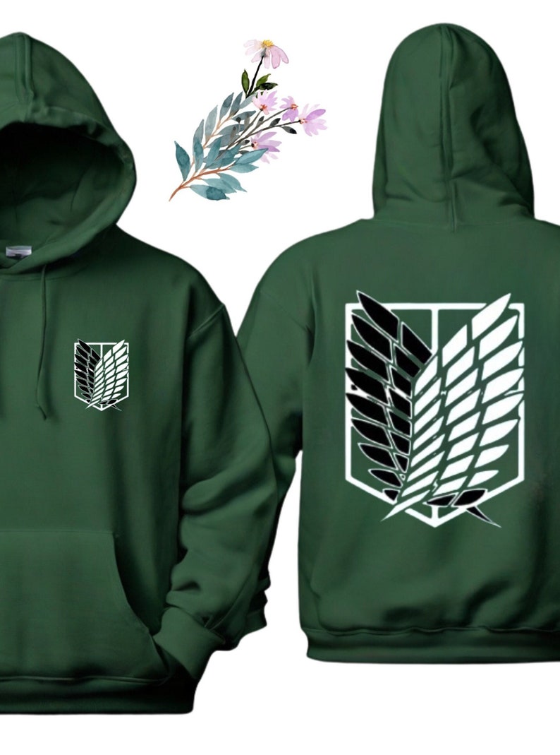 May include: A dark green hoodie with a white and black graphic of the Wings of Freedom symbol from the anime Attack on Titan. The symbol is on the back of the hoodie and a smaller version is on the front left chest.