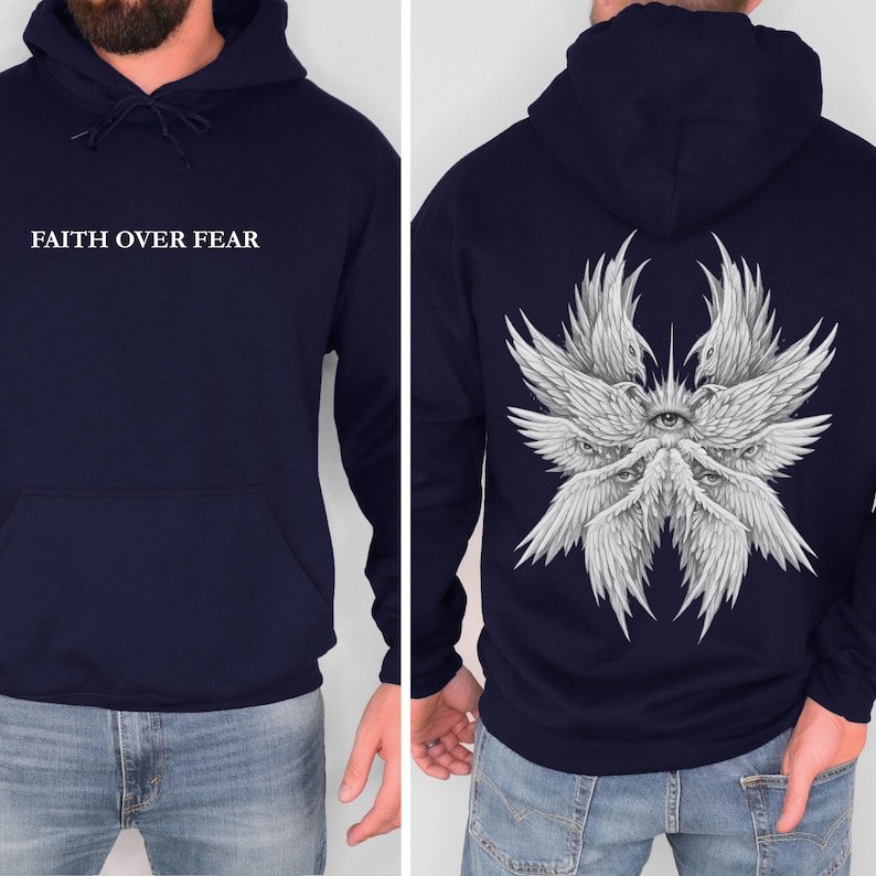 May include: Navy blue hoodie with the text "FAITH OVER FEAR" on the front. The back features a detailed white illustration of a multi-eyed angel with wings. The hoodie has a drawstring hood and a front pocket.