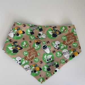 May include: A brown bandana with a repeating pattern of green leaves, white robots, yellow robots, and the text "It's never too late for change" and "I don't want to survive, I want to live".