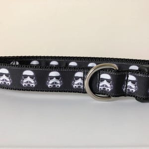 May include: Black dog collar with a white repeated pattern of Star Wars Stormtrooper helmets.
