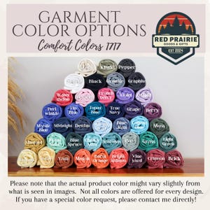 May include: A display of rolled fabric in various colors, including white, black, and blue, with labels identifying each shade. The text "GARMENT COLOR OPTIONS" and "Comfort Colors 1717" are at the top. A logo for Red Prairie Goods & Gifts is in the upper right.