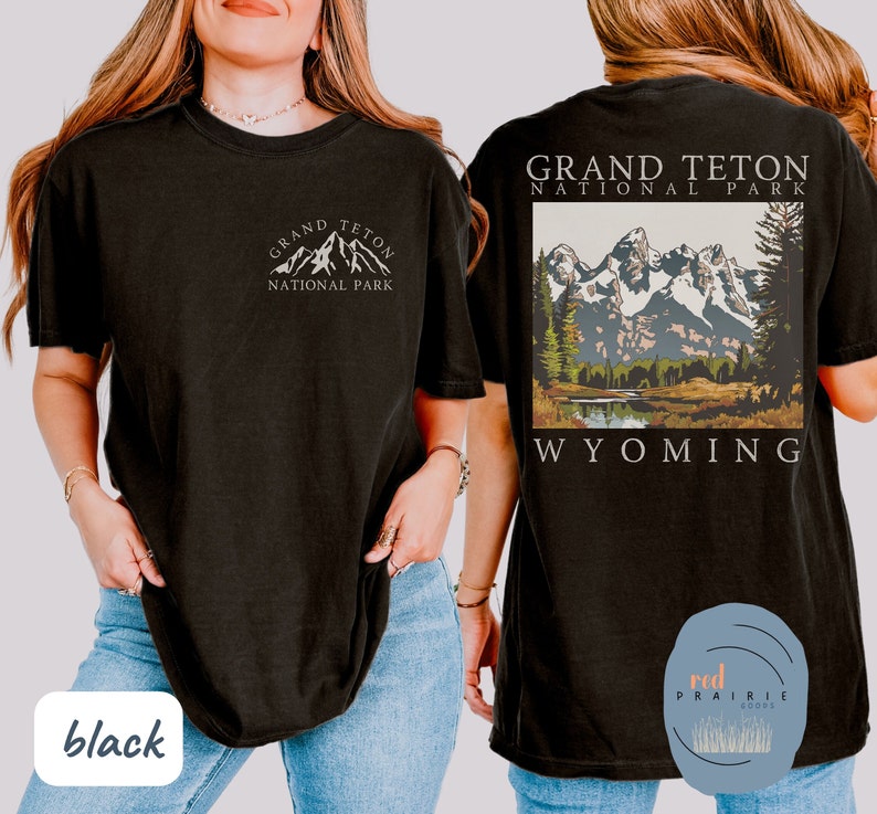 May include: Black t-shirt with a white graphic of the Grand Teton National Park mountains and the text "Grand Teton National Park Wyoming".