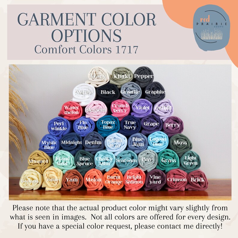 May include: A color chart of rolled fabric swatches in various colors, including white, black, blue, green, red, orange, yellow, and purple. The chart is labeled "GARMENT COLOR OPTIONS Comfort Colors 1717".
