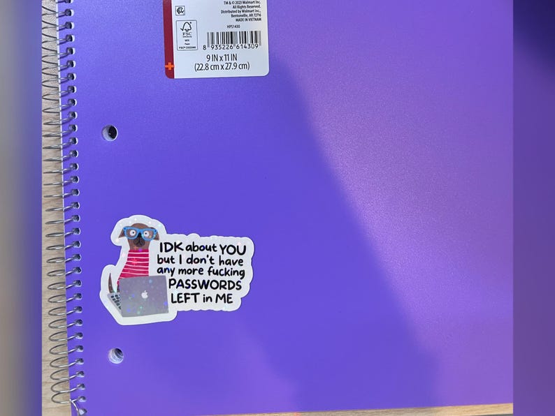 May include: A purple spiral notebook with a sticker that reads "IDK about YOU but I don't have any more fucking PASSWORDS LEFT in ME." The notebook is 9 inches by 11 inches (22.8 cm x 27.9 cm).