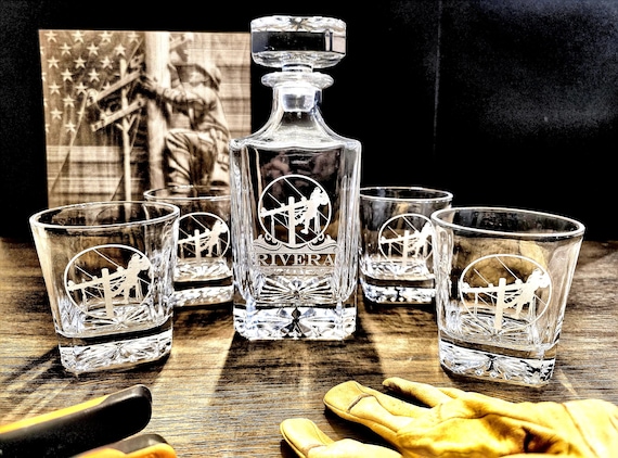 A niche-specific engraved whiskey decanter set calling out the lineman trade — the kind of hyper-targeted gift that makes the recipient feel truly seen.