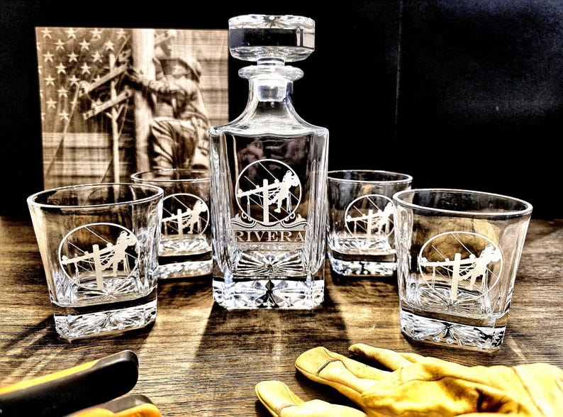 Personalized Lineman whiskey decanter engraved with the Rivera name, displayed with four rocks glasses bearing the standard Lineman emblem.