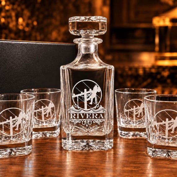 A niche-specific engraved whiskey decanter set calling out the lineman trade — the kind of hyper-targeted gift that makes the recipient feel truly seen.
