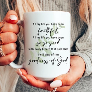 May include: White ceramic mug with a black and green design. The mug features the text "All my life you have been faithful. All my life you have been so so good. With every breath that I am able I will sing of the goodness of God."