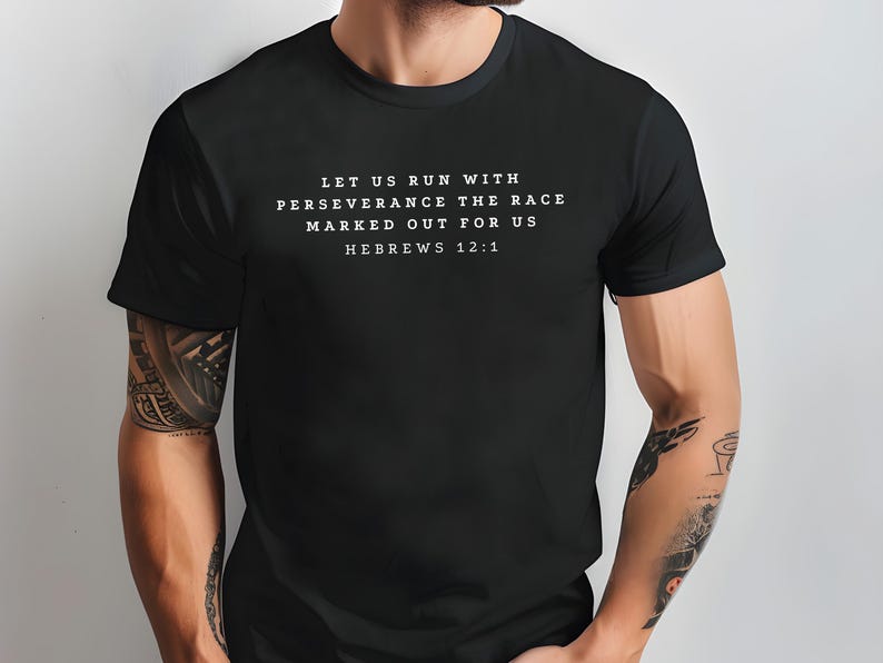 May include: Black t-shirt with white text that reads "Let us run with perseverance the race marked out for us Hebrews 12:1".