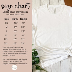 May include: Size chart for a unisex Bella Canvas 3001 t-shirt, a slimmer fit. The chart shows sizes XS through 3XL with corresponding width and length measurements in inches.