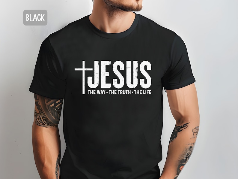 May include: Black t-shirt with a white graphic of a cross and the word "JESUS" with the text "THE WAY - THE TRUTH - THE LIFE" underneath.