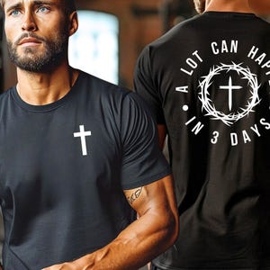 May include: Black t-shirt with a white cross on the front and the text "A lot can happen in 3 days" with a cross inside a crown of thorns on the back.