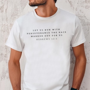 May include: White t-shirt with black text that reads "Let us run with perseverance the race marked out for us Hebrews 12:1"