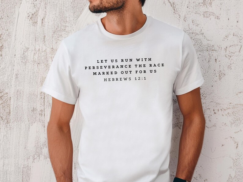 May include: White t-shirt with black text that reads "Let us run with perseverance the race marked out for us Hebrews 12:1"