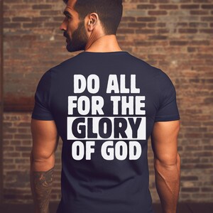 May include: A navy blue t-shirt with white text that reads "Do all for the glory of God".