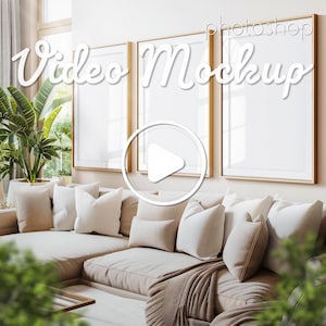 May include: A living room interior with a beige sectional sofa and a play button icon overlayed on the image. The sofa has several white throw pillows and a brown throw blanket. There are three framed pictures on the wall behind the sofa. The text "Video Mockup" is written in white cursive letters on the image.