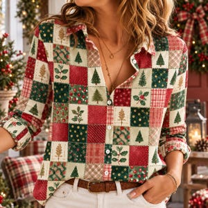 May include: A long-sleeve button-down shirt featuring a patchwork pattern of cream, red, and green squares. The design includes illustrations of Christmas trees, holly leaves, berries, and various textures like polka dots and plaid patterns.