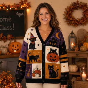 May include: A V-neck button-down cardigan featuring a patchwork design with black cats, orange pumpkins, a witch hat, a broom, stars, and a crescent moon. The knit sweater has a color palette of cream, black, purple, and orange with a black trim.