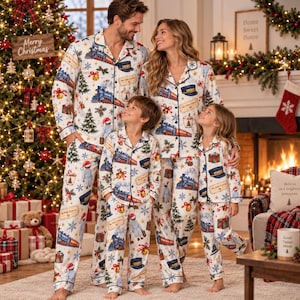 May include: Matching white pajama sets featuring a festive print of The Polar Express trains, conductor hats, Christmas trees, gifts, and snowflakes. Each set includes a long-sleeved button-down shirt and matching pants with a collar.