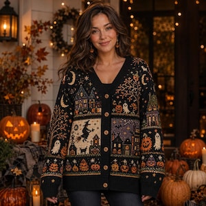 May include: A black V-neck button-down cardigan featuring a detailed knit pattern of Halloween motifs including a witch on a broomstick, haunted houses, ghosts, crescent moons, and orange pumpkins arranged in horizontal panels across the garment.