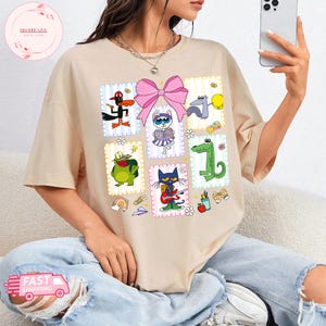 Kokette Schleife Pete The Cat T-Shirt, Pete The Cat Schulshirt, Kinderbuchgeschenk, Groovy Cat Sweatshirt, Kindergärtnerin Shirt Geschenk