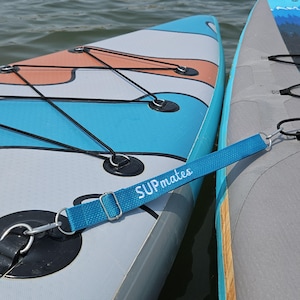 1 TURQUOISE/ WHITE SUPmates strap. 17" adjustable to 28". 1 inch webbing. Embroidered. Durable. Light. Ready to use!