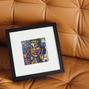 May include: A framed abstract painting of a woman's face with a crown on her head. The painting is done in a colorful style with a mix of geometric shapes and textures.