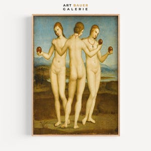 以下が含まれることがあります： 風景の中に立っている3人の裸体の女性の絵。女性たちはそれぞれリンゴを持っています。絵は木製の額縁に入っています。