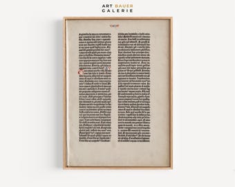 May include: A black and white image of a page from an old book. The text is in a gothic script and is written in Latin. The page is framed in a wooden frame.