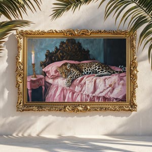 May include: A painting of a leopard lying on a pink bed with a lit candle on a side table. The bed has a ruffled pink bedspread and a white pillow. The painting is framed in a gold ornate frame.