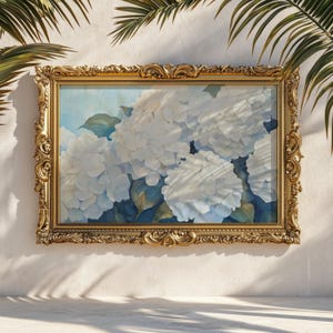 May include: A rectangular painting of white hydrangea flowers with green leaves, set against a soft blue background. The artwork is enclosed in an ornate, metallic gold frame featuring intricate scrollwork and decorative relief patterns.