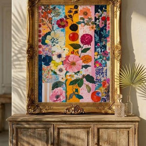 May include: A framed floral artwork with a gold ornate frame. The artwork features vertical stripes of various colors, including blue, yellow, and pink, filled with colorful flowers, berries, and fruit. The artwork is displayed on a wooden cabinet.
