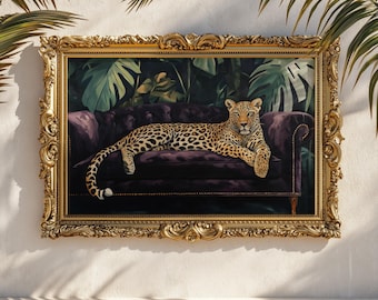 May include: An artwork in a gold frame, depicting a leopard reclining on a purple velvet sofa. The background shows green tropical leaves. The ornate frame enhances the animal portrait's luxurious feel.