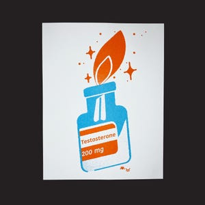 May include: A blue glass bottle with a white label that reads "Testosterone 200 mg". A bright orange flame is on top of the bottle with white sparkles around it.