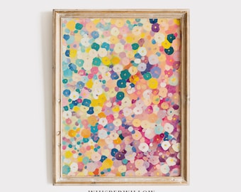May include: A framed wall art print featuring an abstract pattern of small, multicolored circular shapes in shades of pink, yellow, blue, and white. The artwork is enclosed in a light-toned wooden frame with a visible grain, displaying the text Whisperwillow.