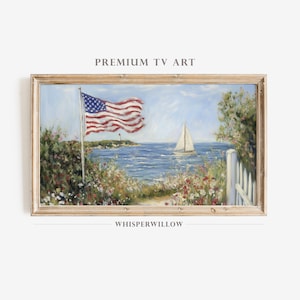 May include: A framed painting depicts a coastal scene with an American flag waving in the wind. A sailboat glides on the blue water. The painting includes a white picket fence, flowers, and the text "PREMIUM TV ART" and "WHISPERWILLOW".