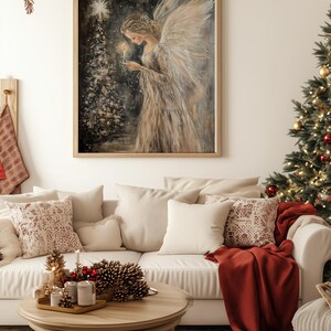 May include: A painting of an angel with wings holding a candle in front of a Christmas tree. The angel is wearing a white gown and has long, flowing hair. The background is a dark blue with white snowflakes.