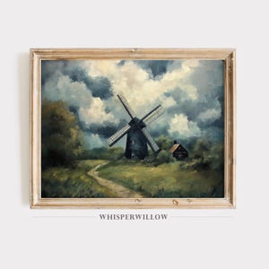 Puede incluir: Una pintura al óleo enmarcada que representa un molino de viento en un paisaje rural. El molino de viento es negro con aspas blancas y se encuentra en un fondo de campos verdes, un camino sinuoso y una pequeña casa. El cielo es una mezcla dramática de nubes oscuras y parches de azul.