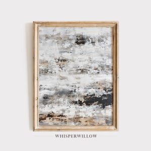 May include: Abstract painting in shades of gray, white, and black with brown accents. The painting is framed in a light wood frame. The painting is titled "WHISPERWILLOW".