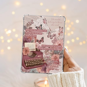 May include: A clear tablet case with a collage design. It features a vintage typewriter, butterflies, and floral elements in pink and burgundy. Text includes inspirational quotes about reading and libraries.