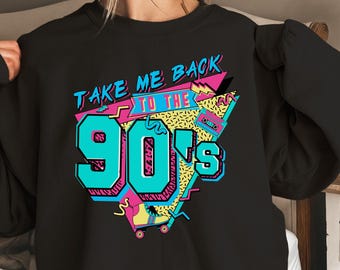 May include: Black sweatshirt with a graphic print of a colorful 90s design. The text on the graphic says "Take Me Back To The 90's".