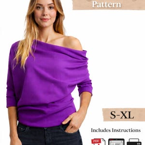 May include: A woman models a vibrant purple off-the-shoulder top. The digital sewing pattern includes instructions and is available in sizes S-XL. The top has long sleeves and is paired with dark wash jeans.
