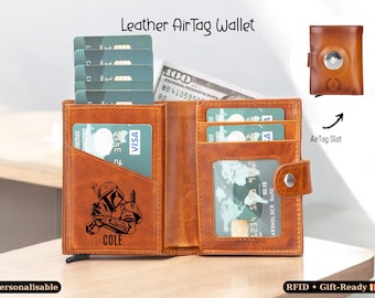 May include: Open leather AirTag wallet with multiple card slots, a clear ID window, and a snap closure. The wallet is brown and features a laser-etched image of a character and the name "COLE". Includes a slot for an AirTag and a hundred-dollar bill.