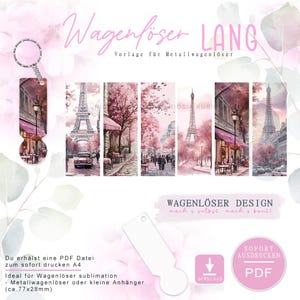 May include: A pink and white design for a metal key tag, featuring a Parisian street scene with the Eiffel Tower. The design includes the text "Wagenlöser LANG" and "Wagenlöser DESIGN". The key tag measures approximately 7.7cm x 2.8cm.