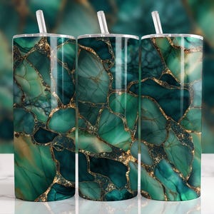 May include: Three stainless steel tumblers with lids and straws. The tumblers are decorated with a green and gold marble pattern.