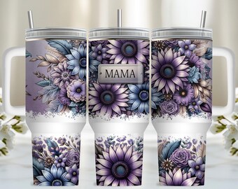 May include: A white stainless steel tumbler with a purple and blue floral design. The tumbler has a lid and a straw. The design features a variety of flowers, including sunflowers, and the word "MAMA" is written on the tumbler.